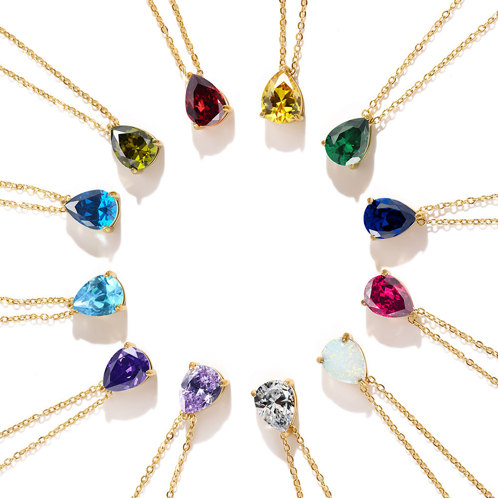 Teardrop necklaces arranged in a circle showing twelve stone colours