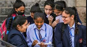 School assembly presentation of December 5, 2025 news headlines including national, international, business, and global market updates.