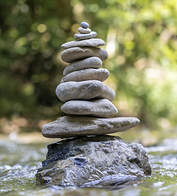 vertical-shot-pyramid-stones-balanced-river-water.jpg