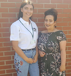 A New Directions employability caseworker (Advocate) standing next to a New Directions participant who has been supported into employment