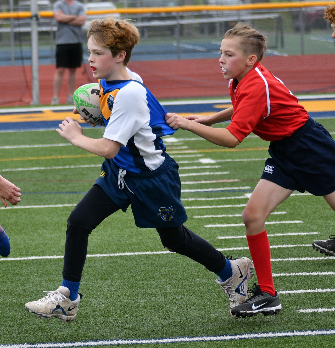 Middle school player breaks a tackle