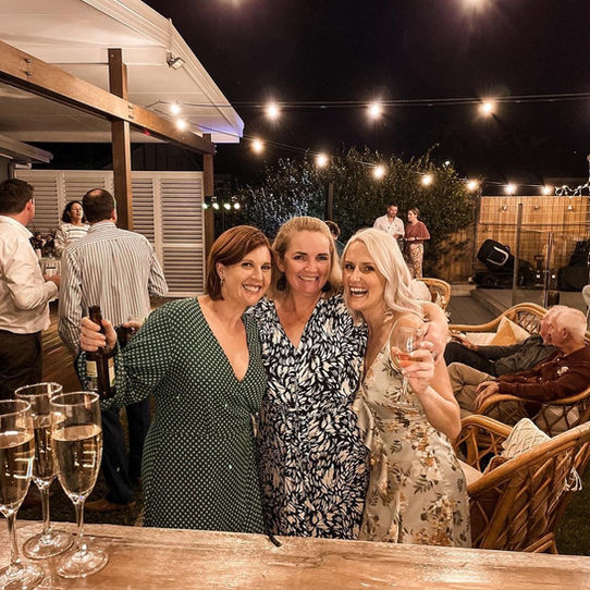 girls smiling with champagne