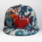 Sea Heart™ Snapback Hat front view with red heart artwork over abstract ocean-blue street-art pattern.