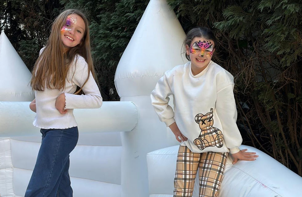 Two girls playing on a jumping castle at a kids birthday party in Johannesburg.