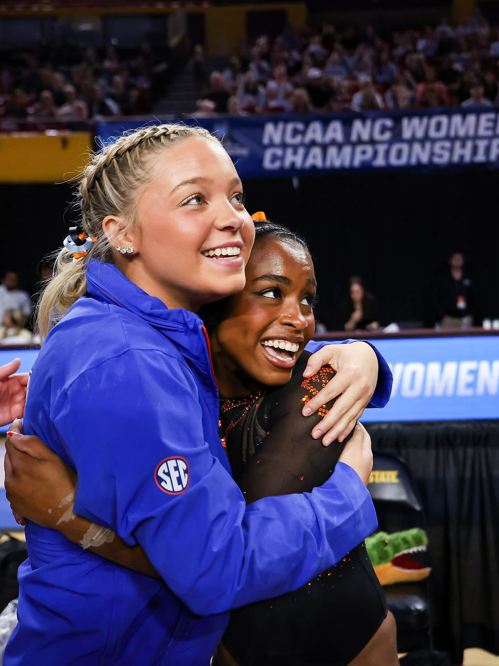 Lily Bruce and Selena Harris-Miranda celebrate a Gator 198 score. (Photo UAA)