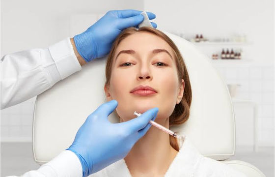a lady in aesthetic clinic happy with service