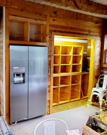 Stainless steel refrigerator and custom wooden shelving