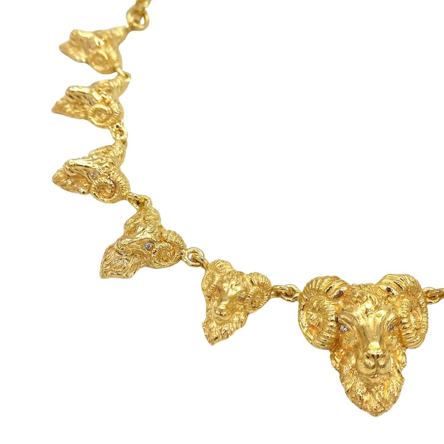 Gold Aries Totem Necklace inspired by the Aries ram symbol. A spiritual pendant representing strength, renewal, and divine gu