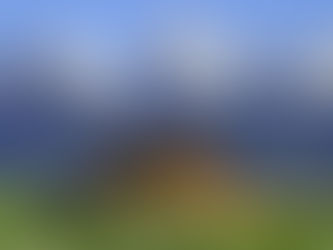 T.A. Moulton Barn in Jackson, Wyoming, with sharp, snowy mountain peaks in the background.