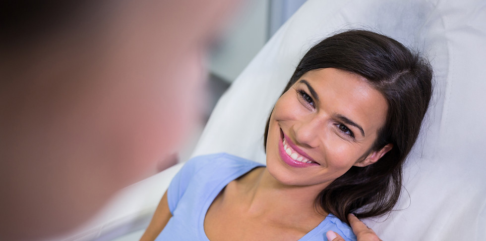 female-patient-smiling-while-talking-doctor.jpg