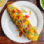 Fully loaded corn on the cob with cheddar, bacon, and scallions.