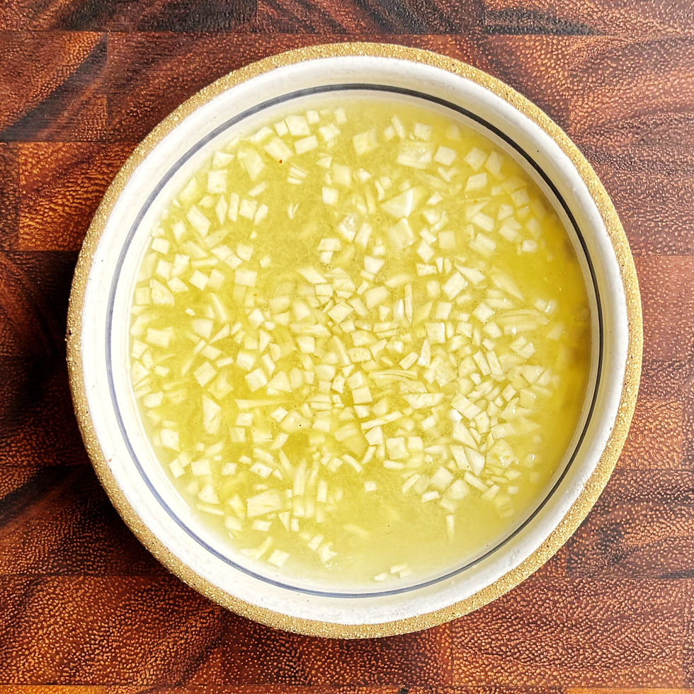 Chopped garlic in lemon juice.