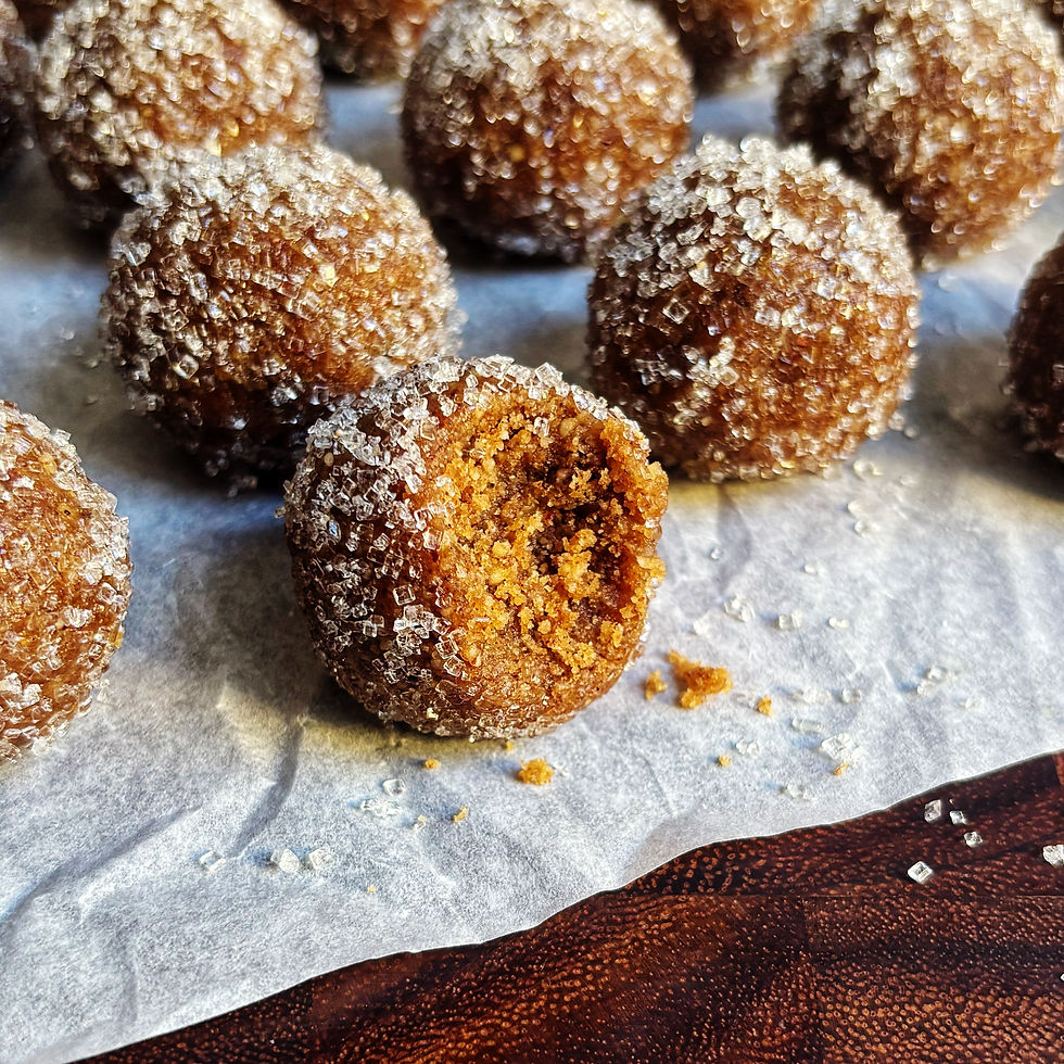 Hot buttered rum balls rolled in sparkling sugar.