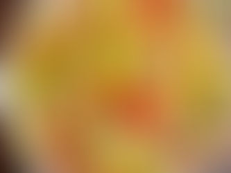 Italian grinder cabbage salad with pepperoni, salami, provolone, cherry tomatoes, peperoncini, and red onions in a white bowl.