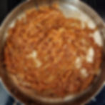 Caramelized onions in a pan.