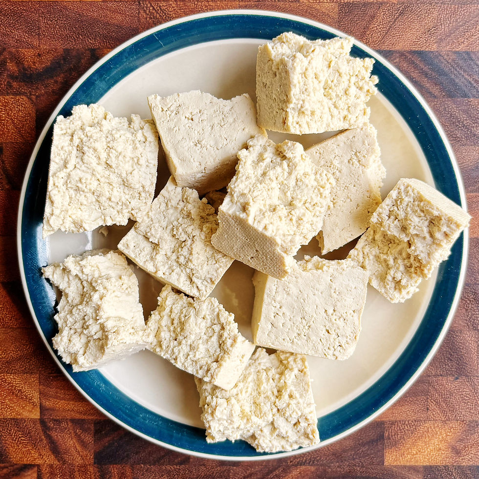 Tofu chunks on a plate.