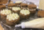 Tray of mini zucchini spice cake filled and frosted with lemon cream cheese frosting.