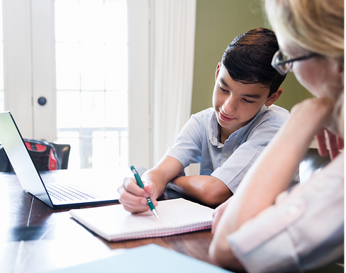 Blonde woman helping younger boy with schoolwork