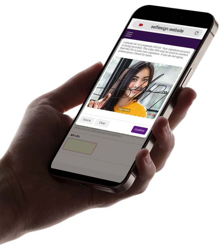 Hand holding smartphone showing selfesign website with a woman’s selfie video and a signature overlay.
