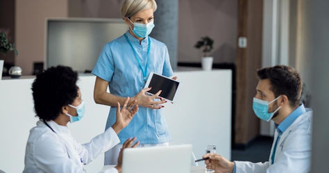 doctors arguing over e-signature on tablet