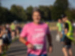 runner running with a pink top with transplant active logo