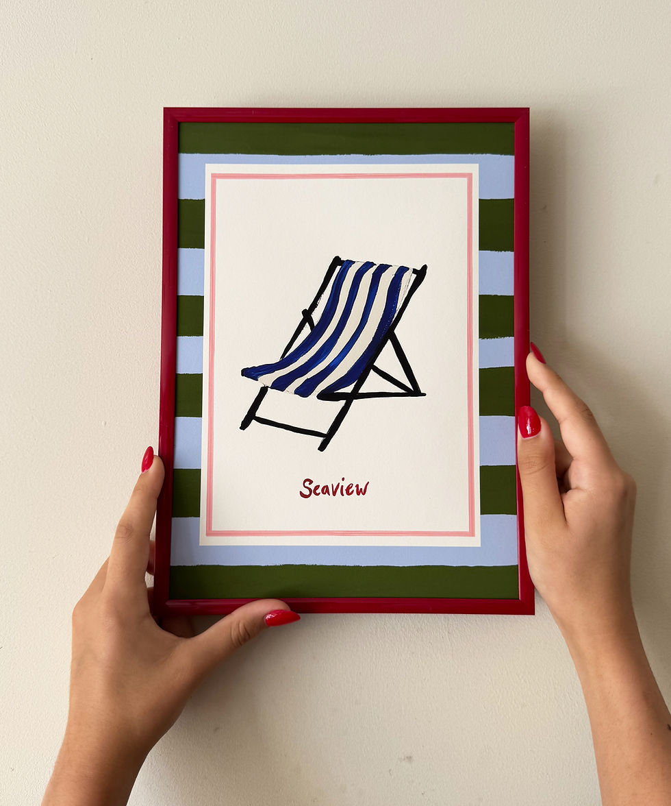 Thumbnail: Seaview print, painted deckchair with striped border in frame being held