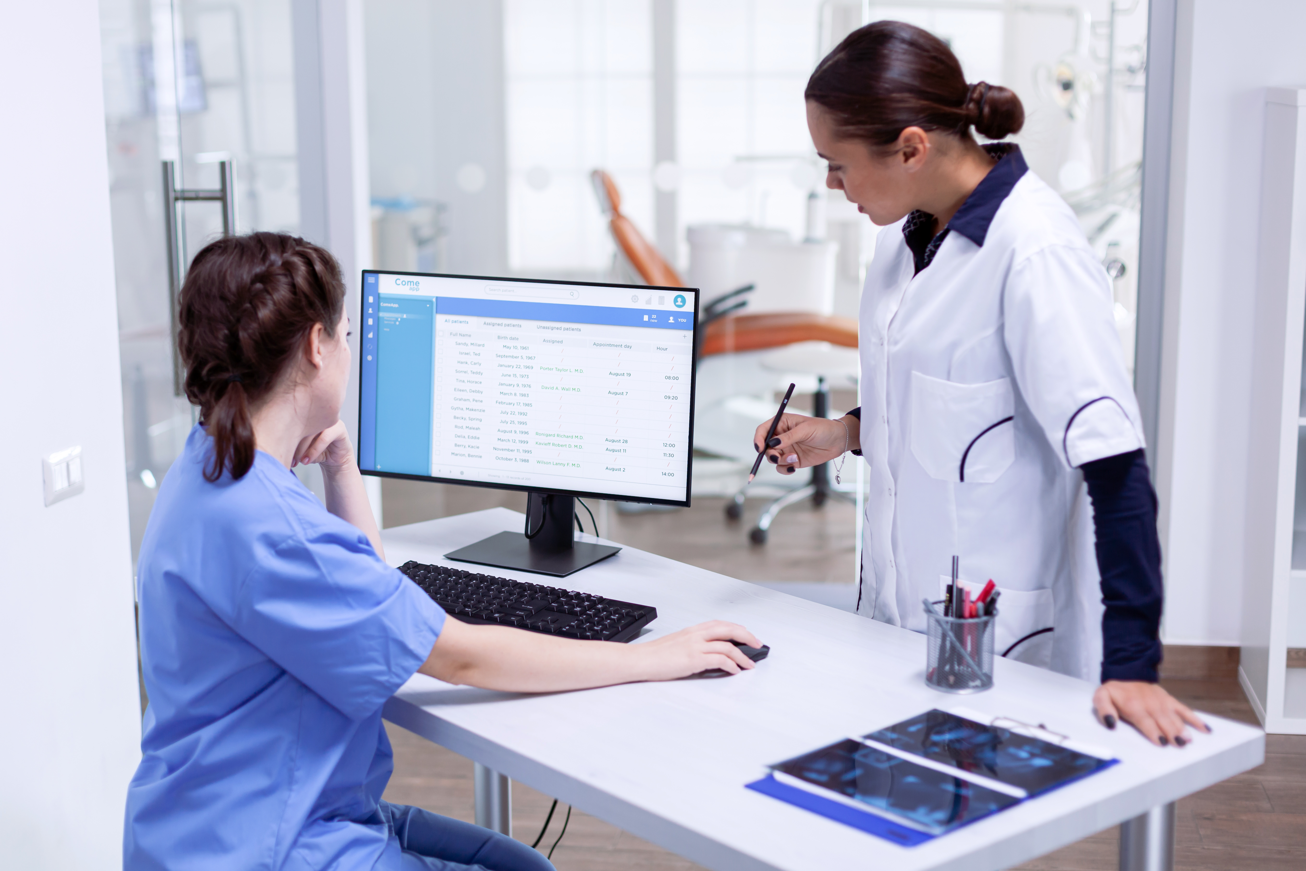 stomatolog-nurse-tooth-clinic-checking-patient-appointment-looking-computer-monitor-stomat