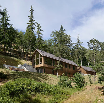 Set on a former orchard overlooking the Hood River Valley, Sanford Spring was designed to respond quietly to its surroundings. Simple gabled forms, natural cedar, and expansive glazing allow the home to settle into the landscape while capturing sweeping views and abundant natural light. Warm wood interiors and a restrained material palette create a timeless custom home that reflects the beauty of contemporary Pacific Northwest architecture.