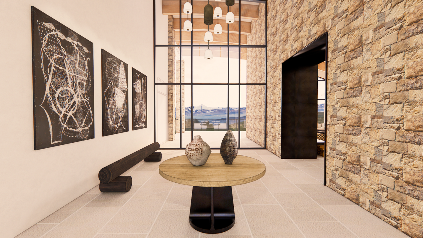 Double-height entry hall with stone walls, sculptural furnishings, oversized windows, and views toward the Columbia River.
