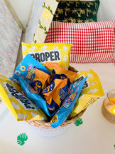 Various Proper snacks in a basket with pillows and decorations