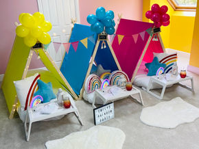 a sign that says emily's rainbow party on it