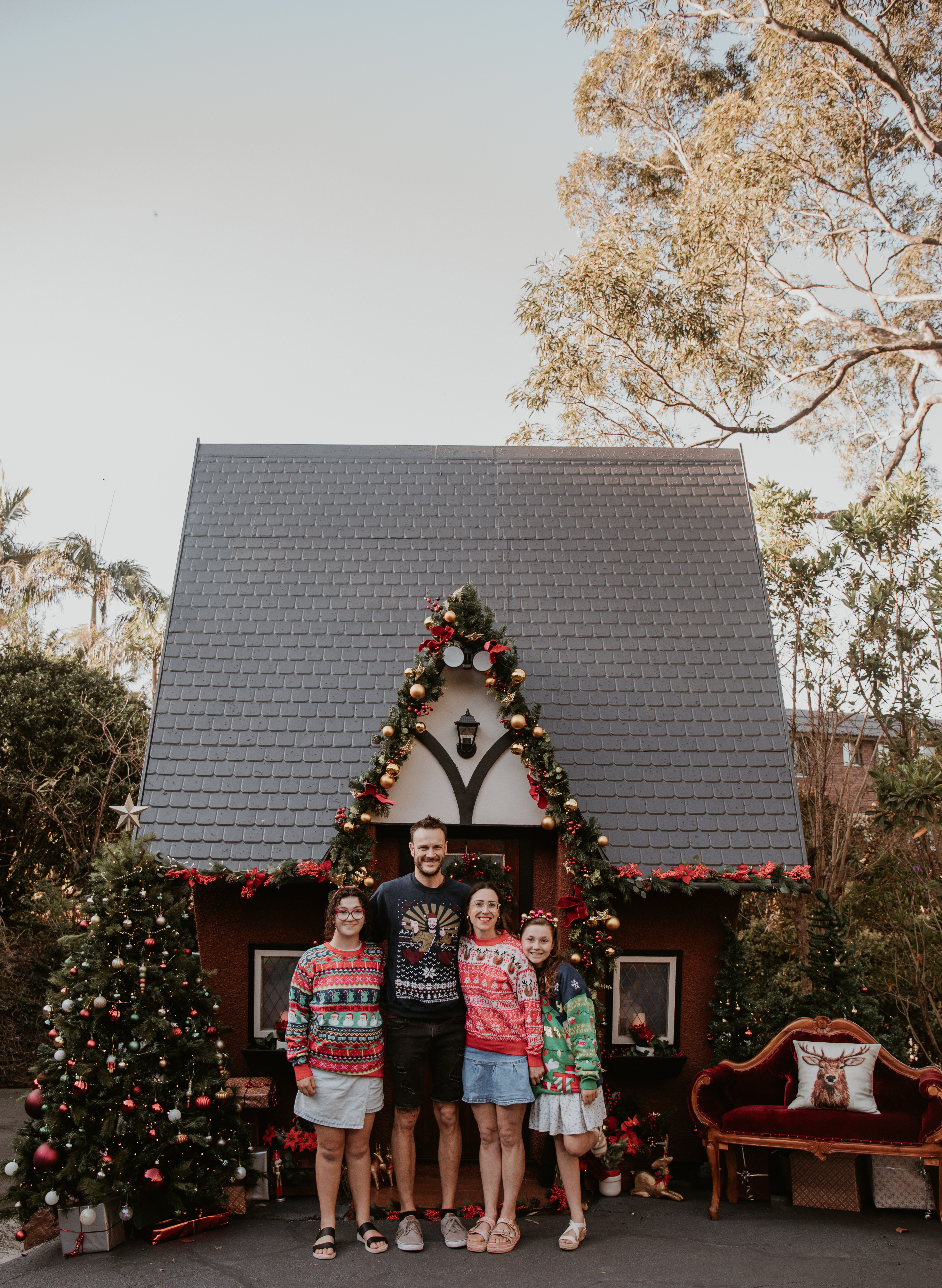 Cottage, featuring children in front of a vintage-inspired Christmas setting.