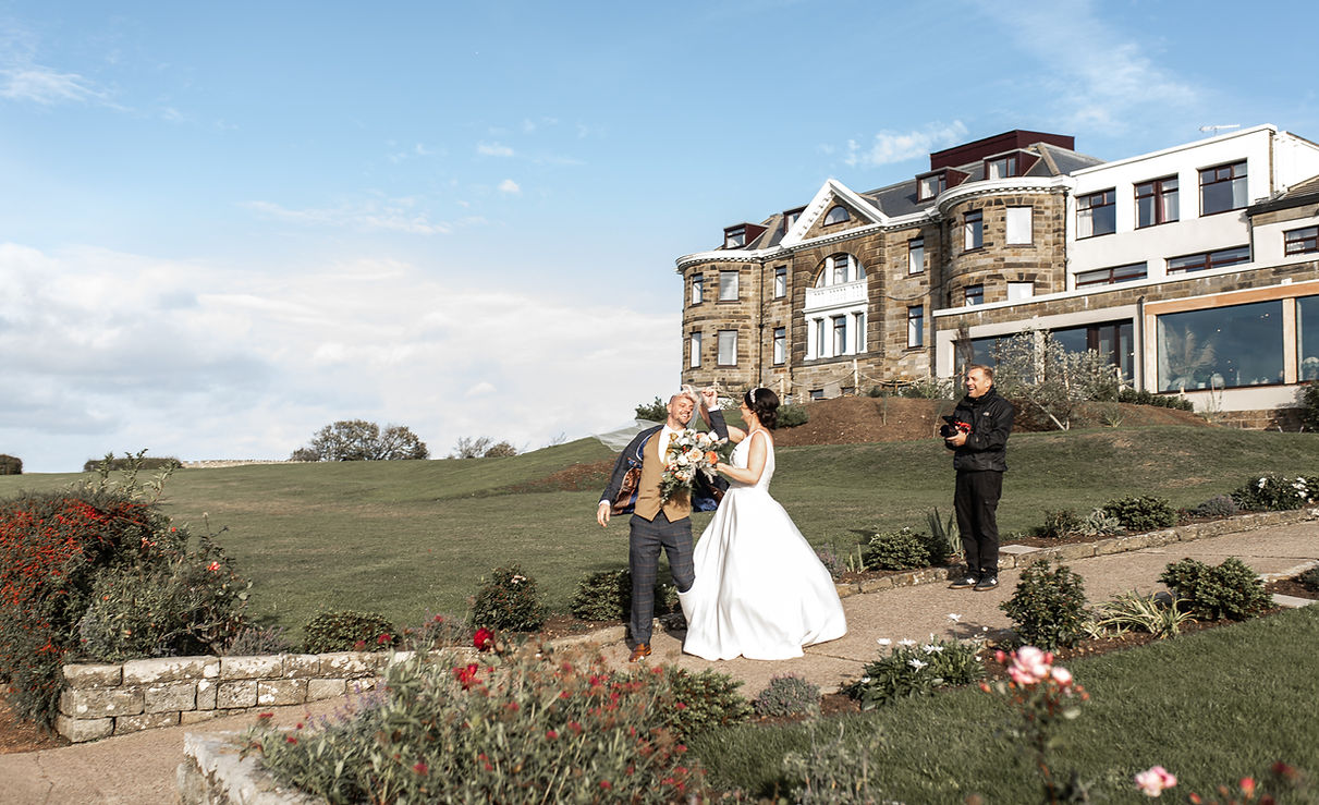 Wedding Videographer with the bride and groom at Grandvilla Heights
