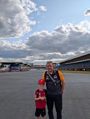 a photo of me and my son at silverstone to watch the formula one 2025