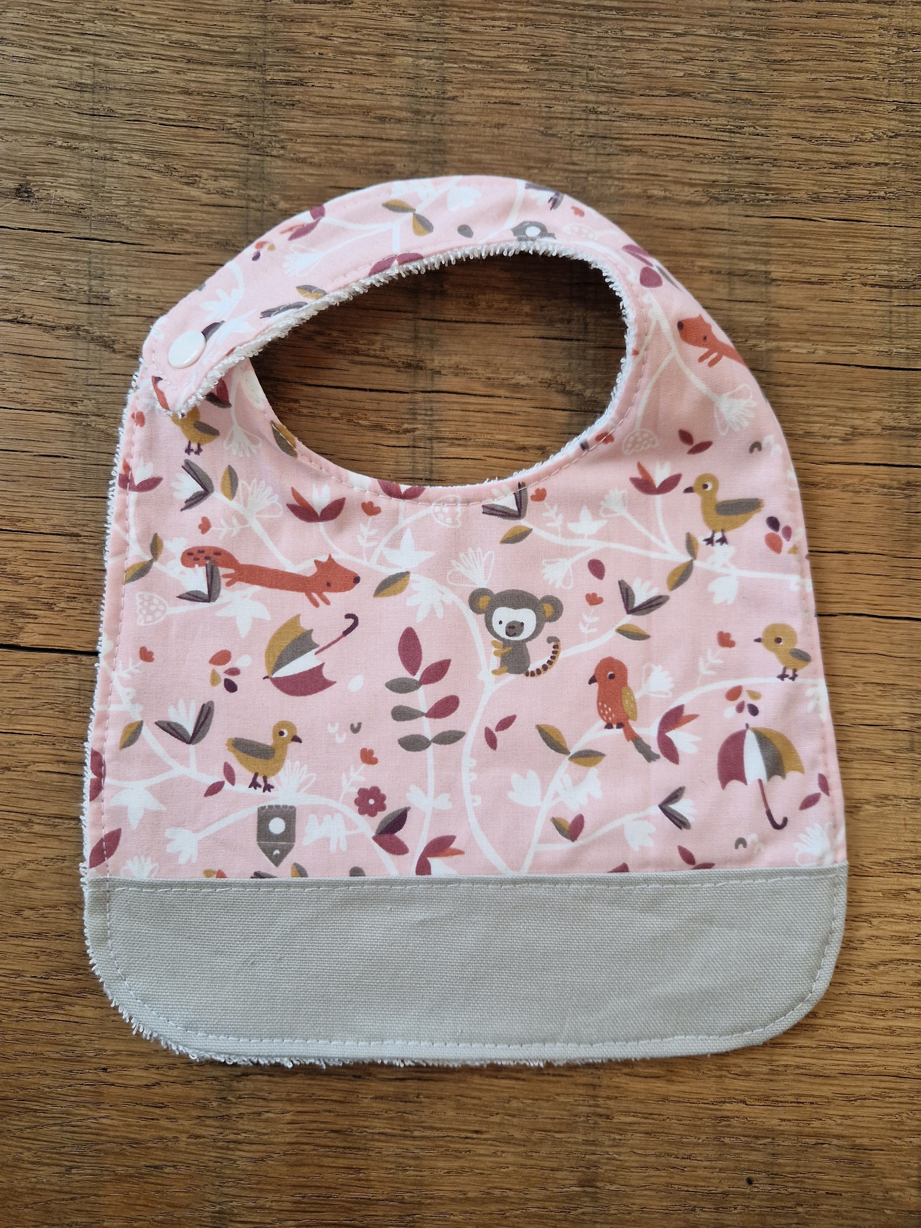 Bavoir "animaux rose"