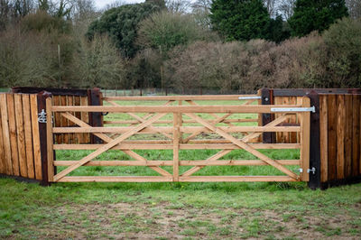 Wooden equestrian gates in a field