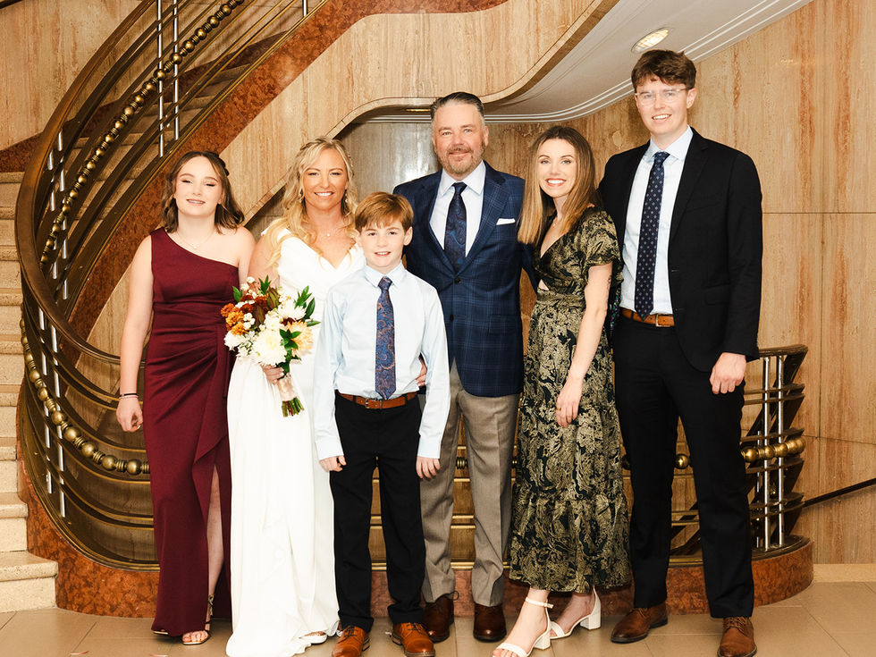 Natural bridal makeup featuring radiant skin, soft taupe eyeshadow, delicate lashes, and nude-pink lips for a timeless weddin