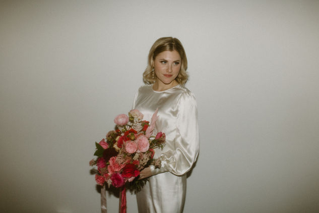 Classic, timeless bridal makeup highlighting delicate features for a sophisticated winter wedding portrait.