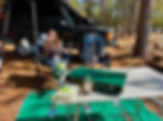 A girl and her dog camping