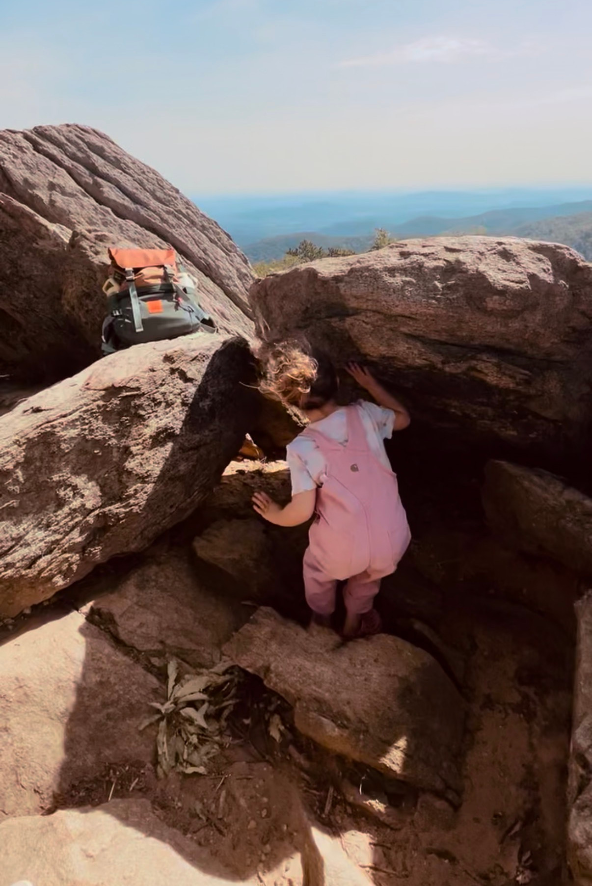 Little girl climbing rocks