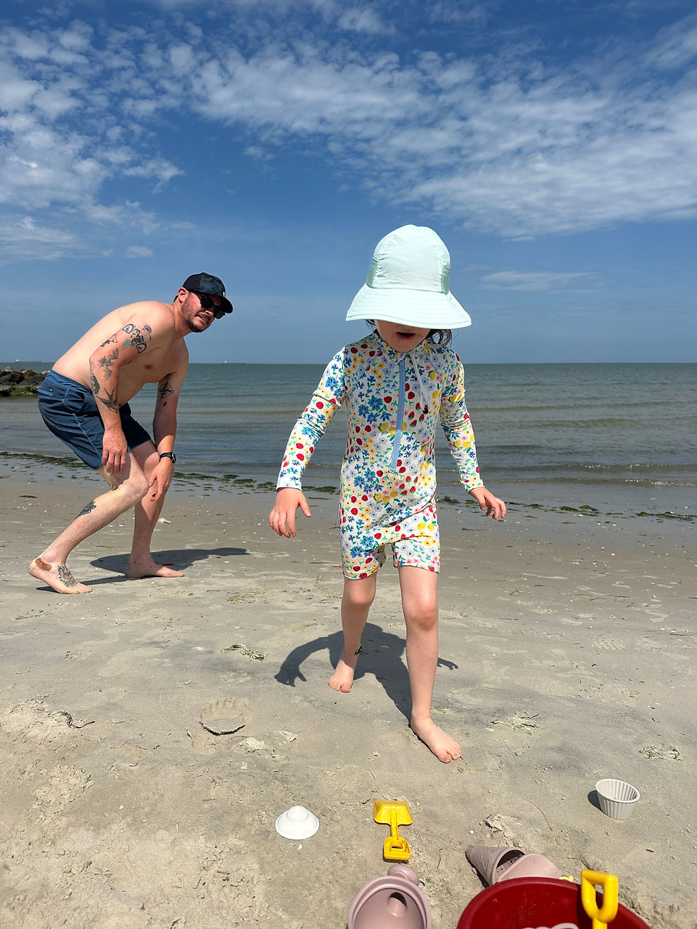 Child and dad at the beach