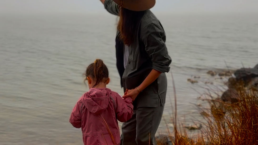 Mom and daughter on misty rainy day in nature