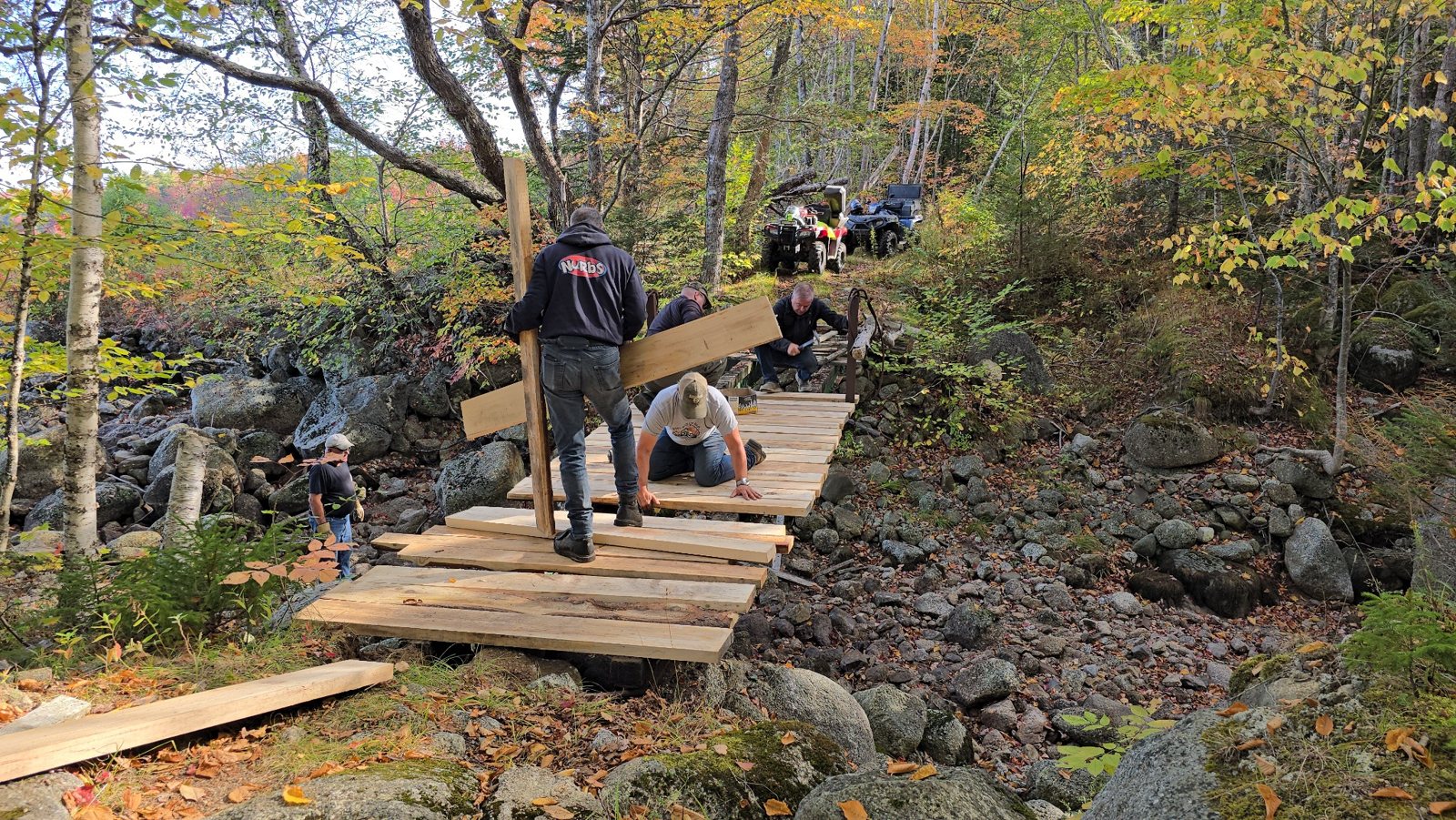 Volunteers redecking the Uniake Lake bridge