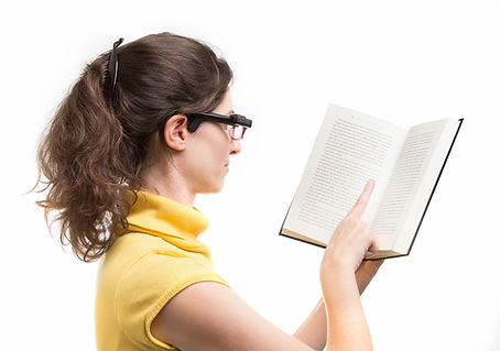 lady reading a book with the help of the OrCam read
