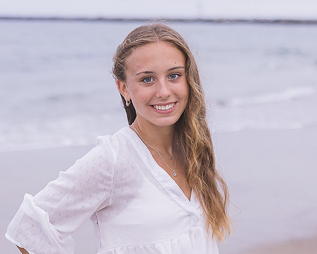 headshot of Bella Scalora with a white long sleeve shirt on