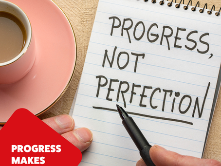 A notebook saying progress not perfection