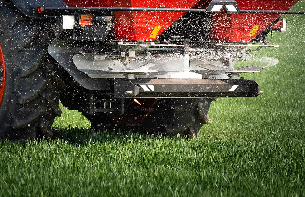 spreading fertiliser on a rural property in Central Victoria, Australia