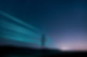 Electricity transmission towers with glowing wires against the starry sky. Energy concept.