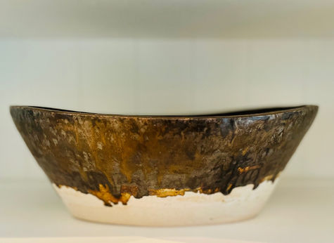 Handmade ceramic basin with dripped metallic glazes