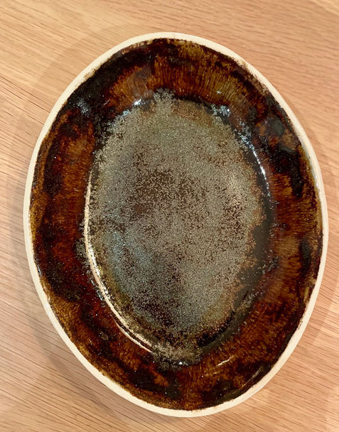 Oval plate with metallic glazes